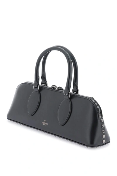 Shop Valentino Garavani Rockstud E/w Leather Handbag