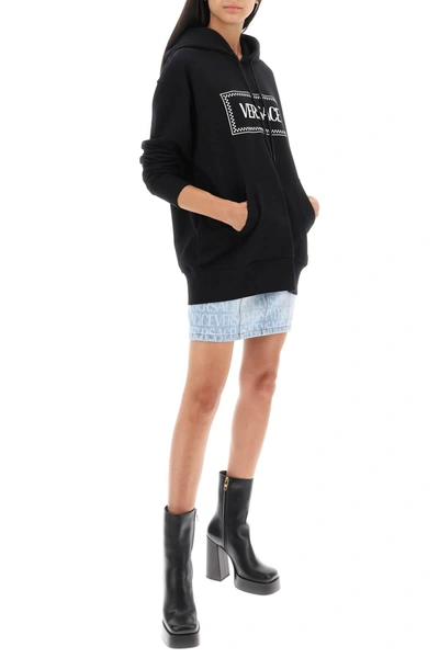 Shop Versace Monogram Denim Mini Skirt