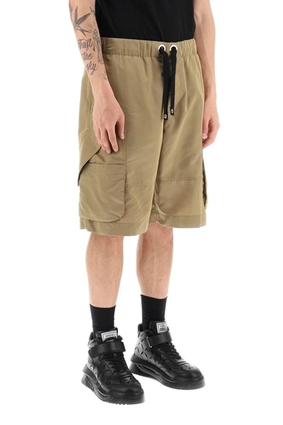 Shop Versace Oversized Nylon Cargo Shorts In Beige