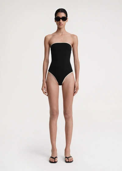 Shop Totême Stripe Edge Strapless Swimsuit Black