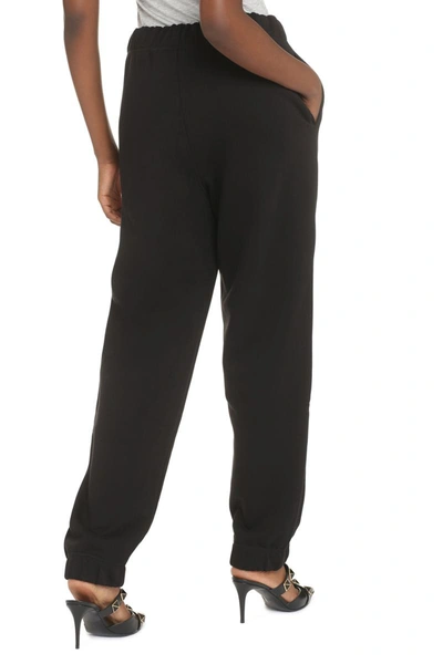 Shop Ganni Logo Print Sweatpants In Black
