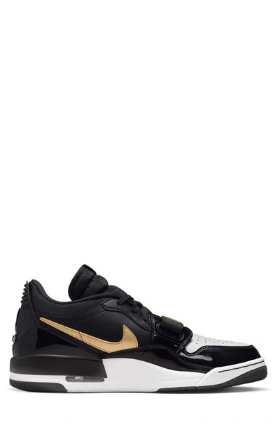 Shop Nike Air Jordan Legacy 312 Low Sneaker In Black/ Metallic Gold/ White