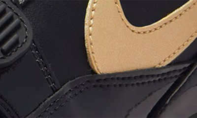 Shop Nike Air Jordan Legacy 312 Low Sneaker In Black/ Metallic Gold/ White