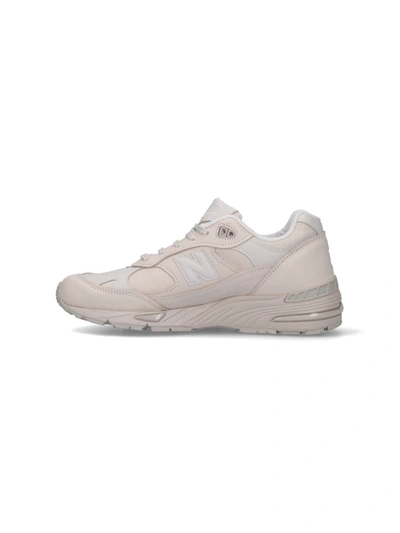 Shop New Balance Sneakers In White