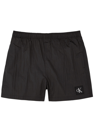 Shop Calvin Klein Logo Shell Swim Shorts In Black