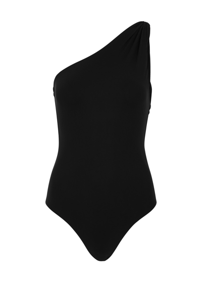 Shop Totême Twisted One-shoulder Swimsuit In Black