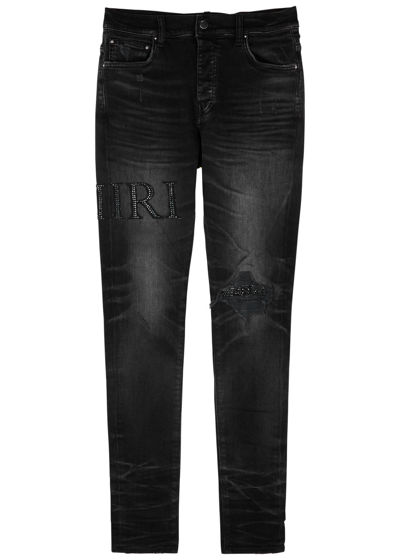 Shop Amiri Logo-embellished Distressed Skinny Jeans In Black