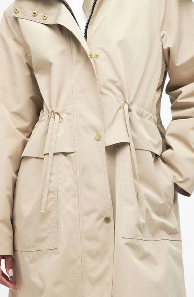 Shop Barbour Lotte Hooded Waterproof Trench Coat In Light Fawn/ Muted