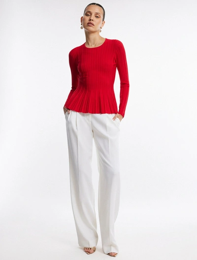 Shop Bcbgmaxazria Long Sleeve Rib Peplum Knit Top In Fiery Red