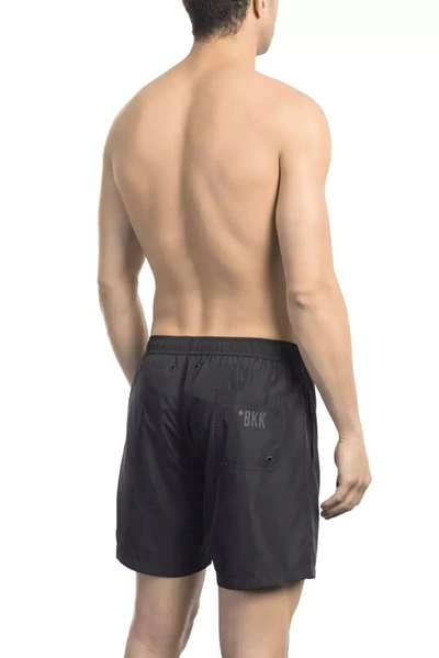 Shop Bikkembergs Chic Side Print Swim Shorts For The Modern Men's Man In Black
