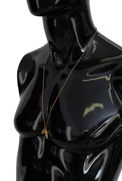 Shop Dolce & Gabbana Elegant Gold Tone Charm Necklace With Cross Women's Pendant
