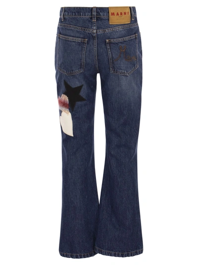 Shop Marni Denim Flare Trousers With Knitted Appliqués