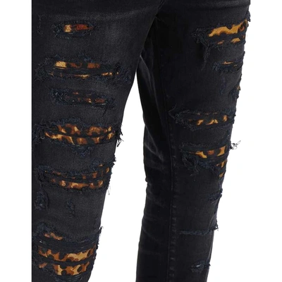 Shop Amiri Leopard Denim Jeans