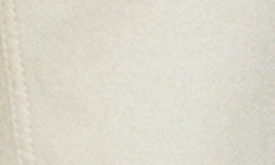 Mango Raw Hem Mid Rise Flare Jeans In Ecru