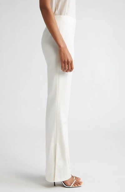 Shop Alice And Olivia Lara Embellished Side Slit Flare Pants In Ecru