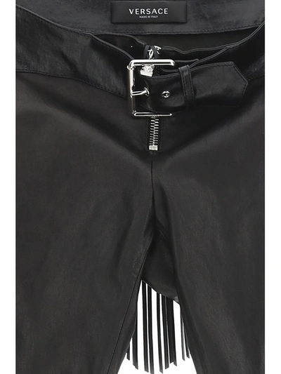 Shop Versace Trousers In Black