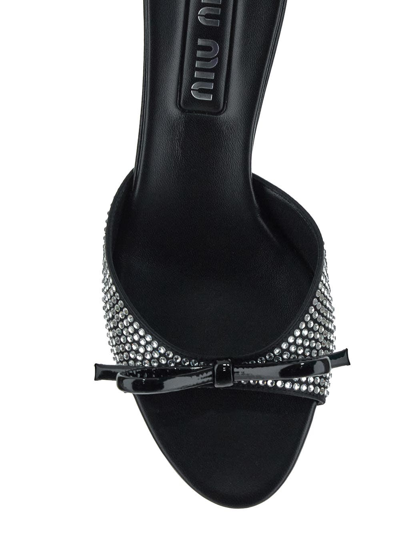 Shop Miu Miu Crystal-embellished Sandals In Black