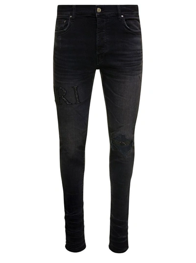Shop Amiri Black Skinny Jeans With Crystal Embellished Logo And Used Effect In Stretch Cotton Denim