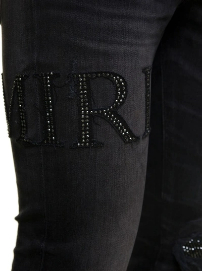 Shop Amiri Black Skinny Jeans With Crystal Embellished Logo And Used Effect In Stretch Cotton Denim