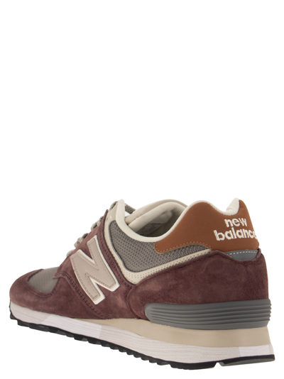 Shop New Balance 576 Sneakers