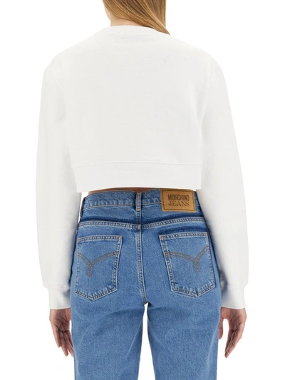 Shop Moschino Jeans Sweatshirt With Logo In White