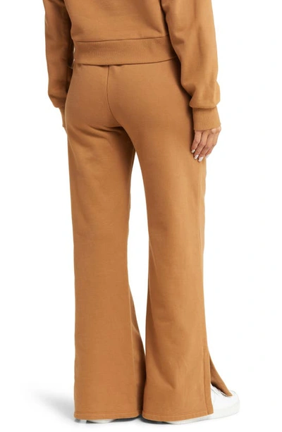 Beyond Yoga On The Go Wide Leg Flare Pants In Toffee