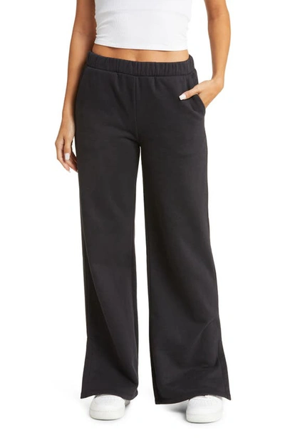 Shop Beyond Yoga On The Go Wide Leg Flare Pants In Black