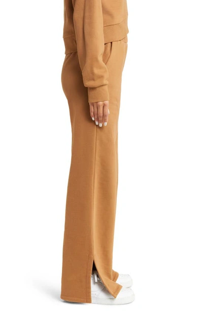 Beyond Yoga On The Go Wide Leg Flare Pants In Toffee