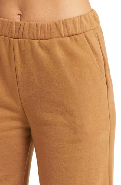 Beyond Yoga On The Go Wide Leg Flare Pants In Toffee