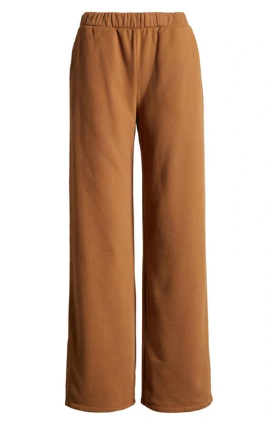 Beyond Yoga On The Go Wide Leg Flare Pants In Toffee