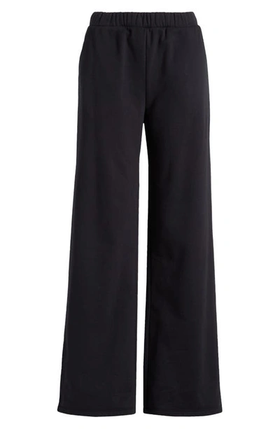 Shop Beyond Yoga On The Go Wide Leg Flare Pants In Black