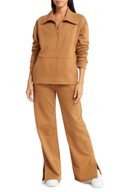 Beyond Yoga On The Go Wide Leg Flare Pants In Toffee