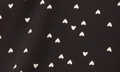 Shop Cece Heart Print Smocked Cuff V-neck Top In Rich Black
