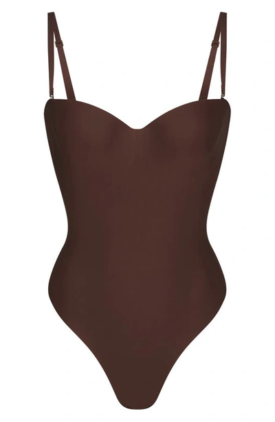 Shop Skims Molded Underwire Thong Shaper Bodysuit In Cocoa