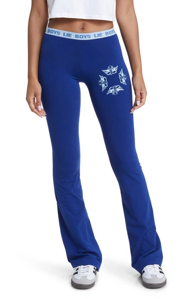 Shop Boys Lie Head Over Heels Graphic Flare Leg Yoga Pants In Blue