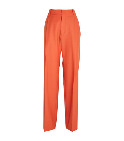 Shop Victoria Beckham Pleated Wide-leg Trousers In Orange