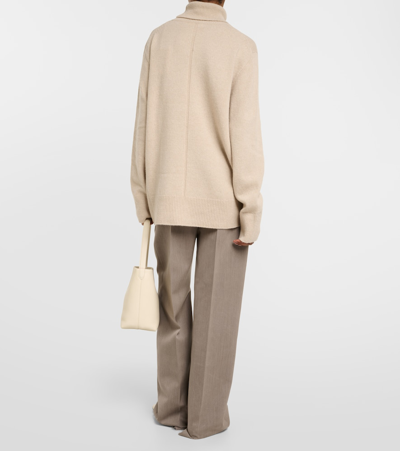 The Row Stepny Oversized Wool And Cashmere-blend Turtleneck Sweater In Beige