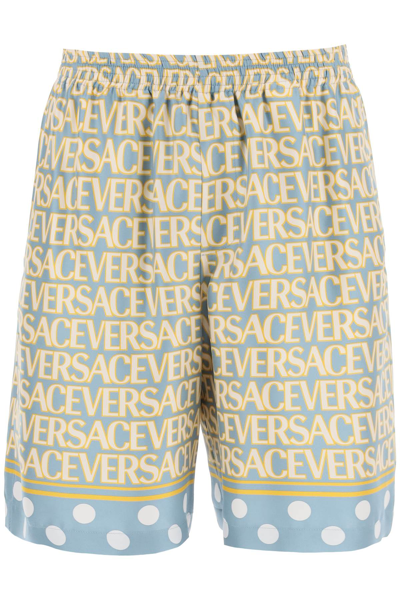 Versace Silk Bermuda Shorts With All-over Logo In Light Blue Ivory