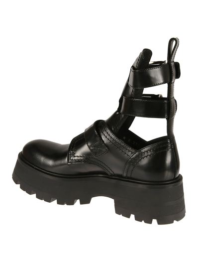 Shop Alexander Mcqueen Multi Side Buckled Leather Boots In Black/silver