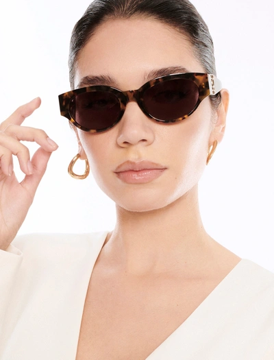 Shop Bcbgmaxazria Signature Oval Icon Sunglasses In Blonde Demi