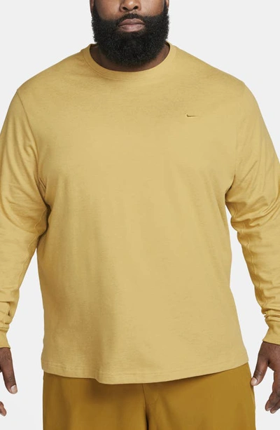 Shop Nike Dri-fit Primary Long Sleeve T-shirt In Bronzine/ Heather
