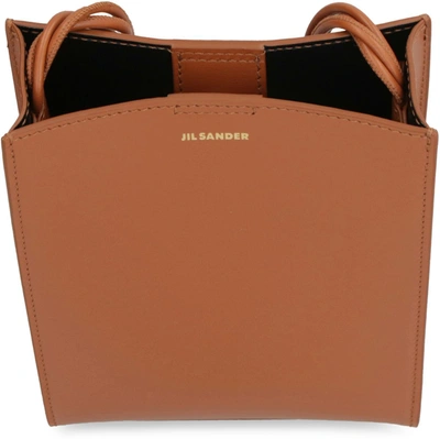 Shop Jil Sander Tangle Leather Crossbody Bag In Brown