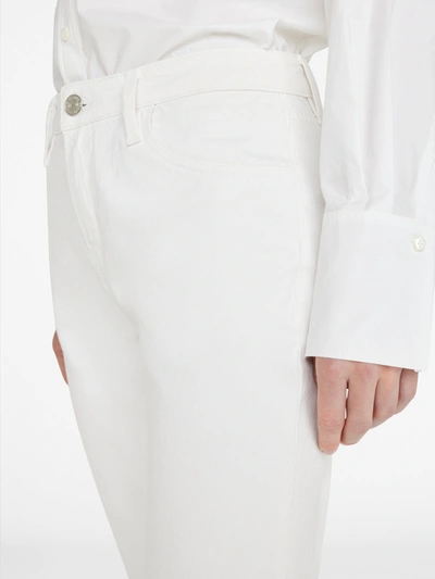 Shop Frame The Low Bootcut Jeans In White