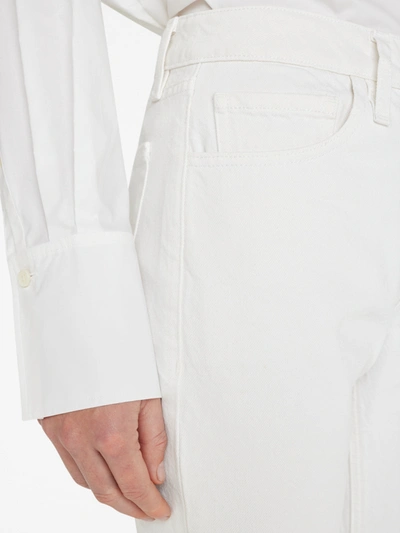 Shop Frame The Low Bootcut Jeans In White