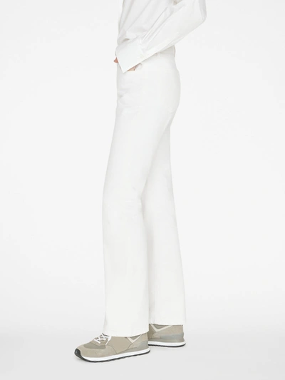 Shop Frame The Low Bootcut Jeans In White