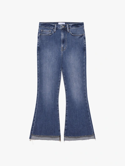 Shop Frame Le Crop Flare Raw Stagger Jeans In Blue