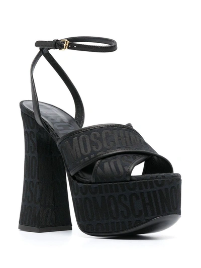 Shop Moschino Sandals In Black