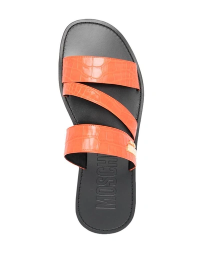 Shop Moschino Sandals In Orange