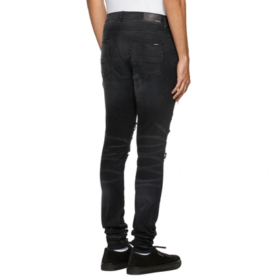 Shop Amiri Leopard Denim Jeans