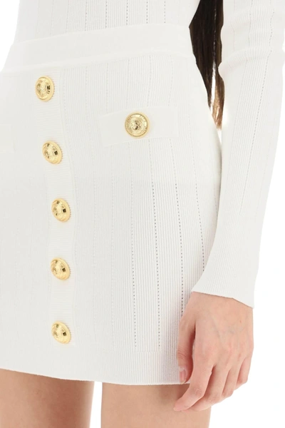 Shop Balmain Knit Mini Skirt With Embossed Buttons
